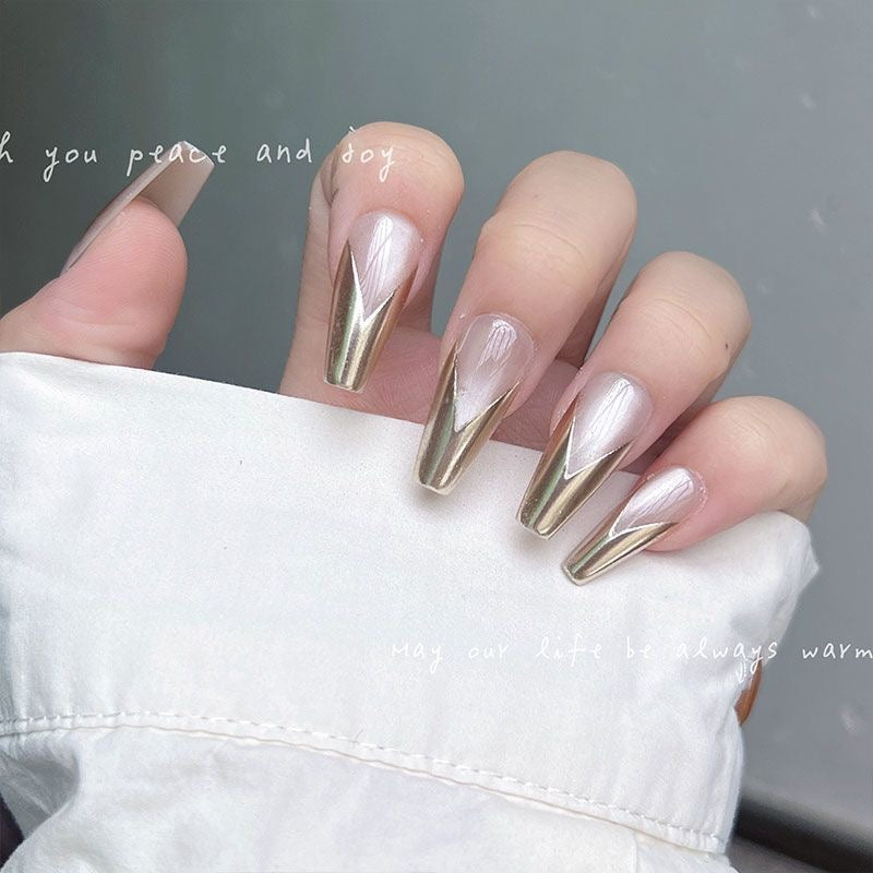 Coffin Nail Design – Nude Base with Metallic Gold V-Tips